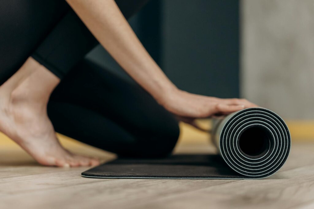A person using a yoga mat